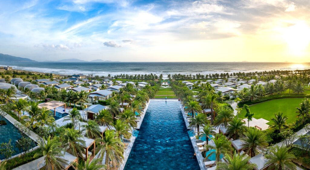Crafting Captivating Headlines: Your awesome post title goes here Discover a stunning beach resort with lush gardens and infinity pool overlooking the ocean at sunset.